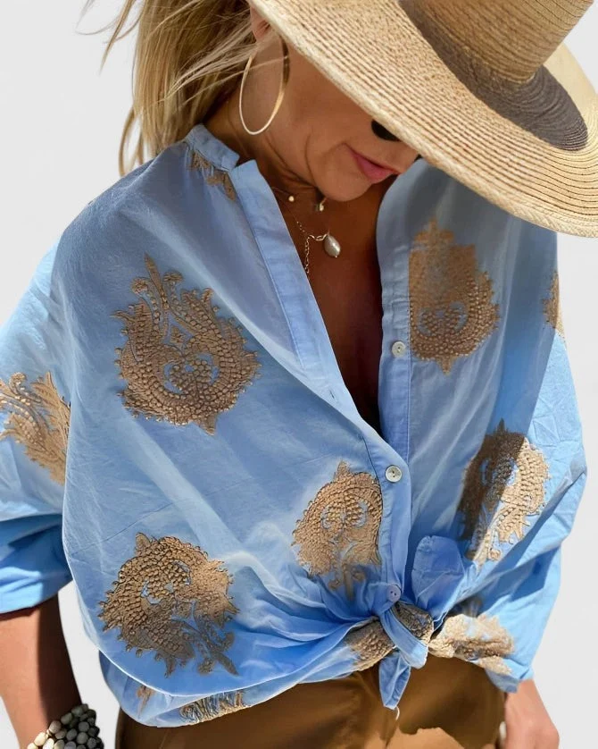 Dames blouse met bladprint en knoopsluiting