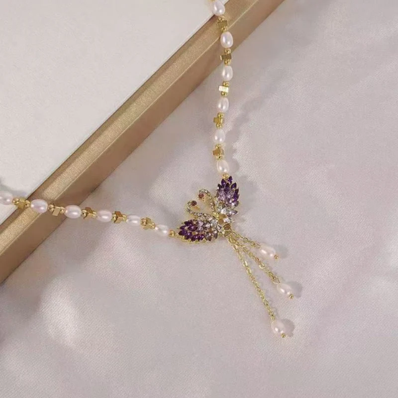 Paarse dubbele zwaan hanger ketting met fantasieparels