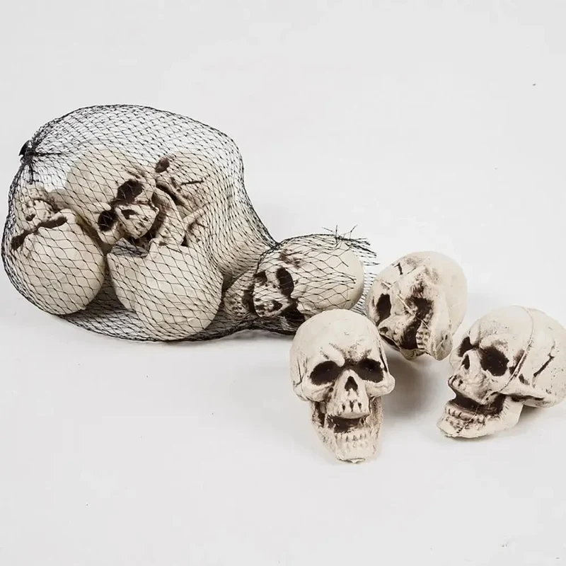 Halloween Home Décor Set of Miniature Plastic Skulls with an Aged Finish