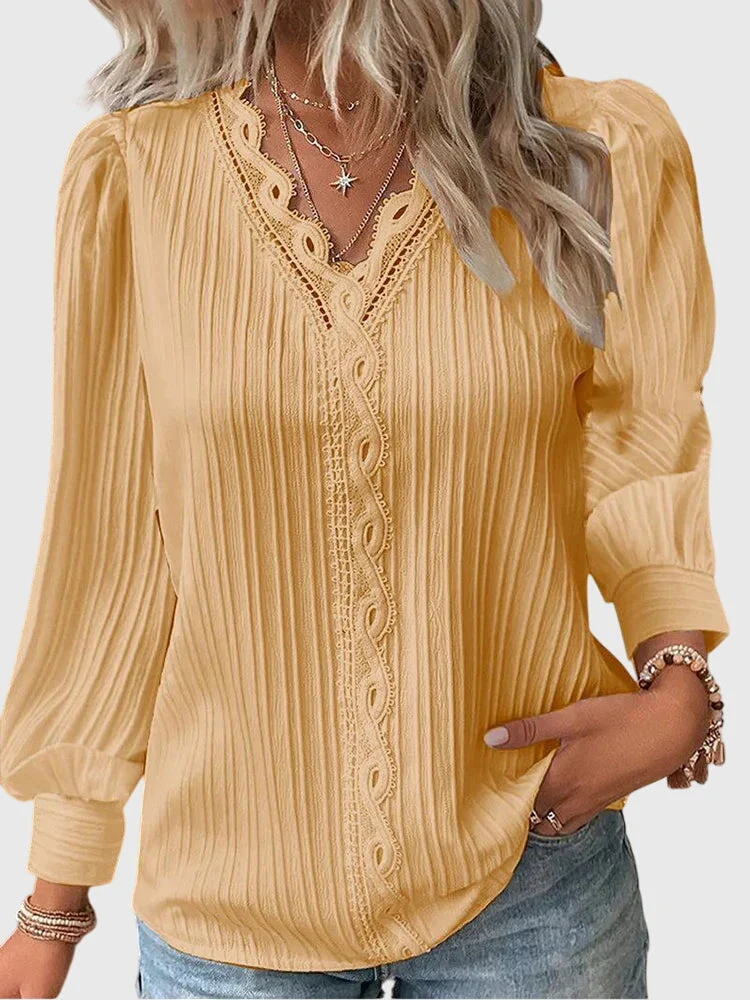Dames blouse met V-hals en geplooide structuur