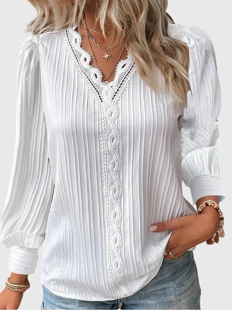 Dames blouse met V-hals en geplooide structuur
